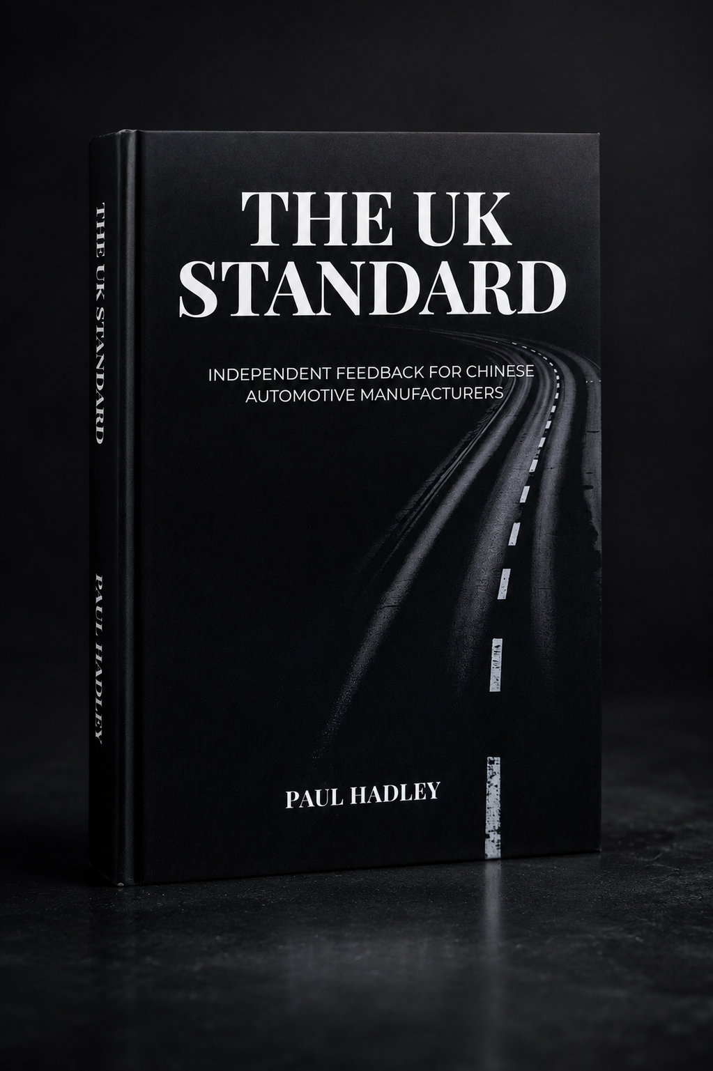 The UK Standard report, a matte black paperback with serif title typography